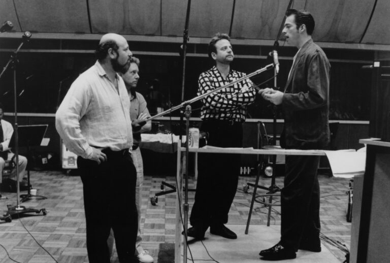 Rob Reiner watches as Harry Connick Jr. sings for the soundtrack to the movie "When Harry Met Sally," circa 1989. (Hulton Archive/Getty Images)