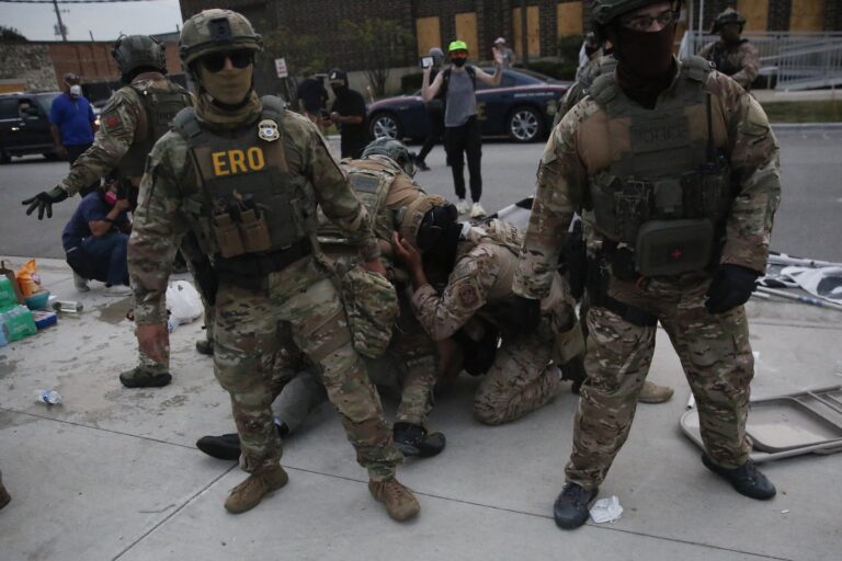 Immigration and Customs Enforcement (ICE), Special Response Team Police and Enforcement and Removal Operations (ERO) agents detain a demonstrator during a protest outside an ICE processing center in Broadview, Illinois, on September 19, 2025. US President Donald Trump ordered increased federal law enforcement presence in Illinois and stepped-up immigration enforcement actions by the Department of Homeland Security. (Photo by Octavio Jones/Getty Images)