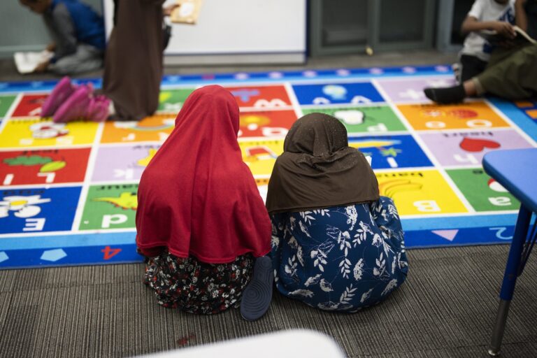 Children read at ABC Learning Center Inc. in Minneapolis, Minn., on Tuesday, December 30, 2025.  A viral video showed a YouTubers knocking on doors of Somali run daycares and claiming there were no children there. This daycare was featured in the video but did not allow the Youtuber in to the building. They were accused of being fraudsters. (Photo by Renee Jones Schneider/The Minnesota Star Tribune via Getty Images)