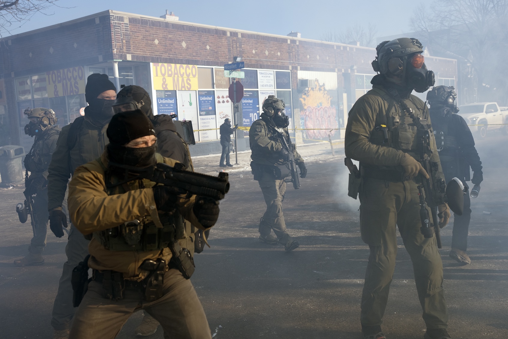 ICE officers clash with protesters after federal agents fatally shot a man this morning in south Minneapolis, setting off confrontations between protesters and agents on the Eat Street section of Nicollet Avenue  in Minneapolis, Minn., on Saturday, Jan. 24, 2026. (Photo by Richard Tsong-Taatarii/Getty Images)