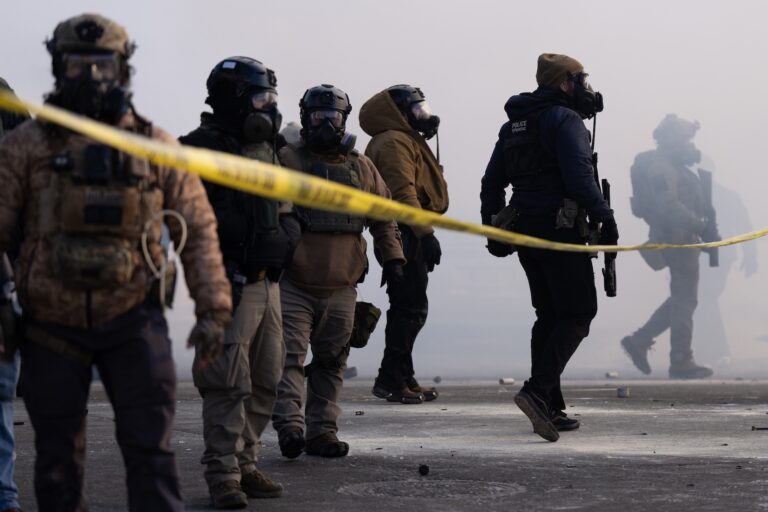 Federal agents stand in tear gas and face protesters on Nicollet Avenue near West 26th St. in Minneapolis, Minn. on Saturday, Jan. 24, 2026. Federal agents fatally shot a man during an arrest in the morning (Photo by Alex Kormann/Getty Images)