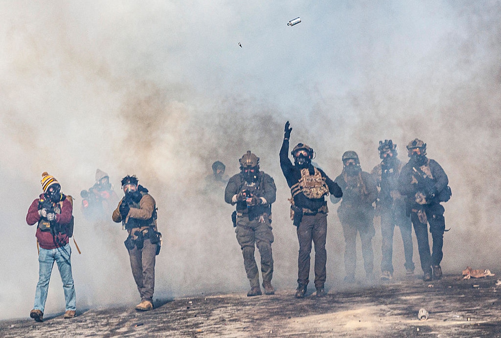 Federal agents advance toward protesters with guns and tear gas in Minneapolis following the fatal shooting of Alex Pretti on Jan. 24, 2026. ( Kerem YUCEL / AFP via Getty Images)