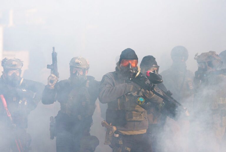 Federal agents at an anti-ICE protest in Minneapolis after Alex Pretti's fatal shooting by Border Patrol agents on Jan. 24, 2026. (Richard Tsong-Taatarii/The Minnesota Star Tribune)