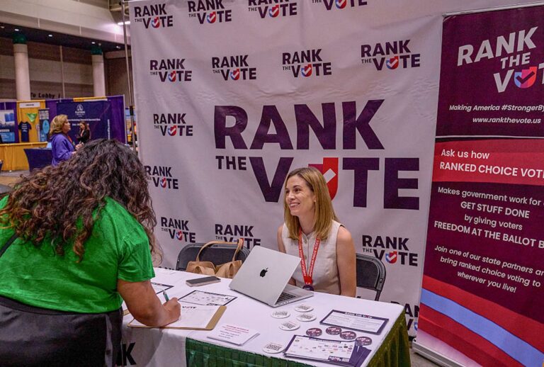 A booth promoting ranked choice voting at Netroots Nation 2025