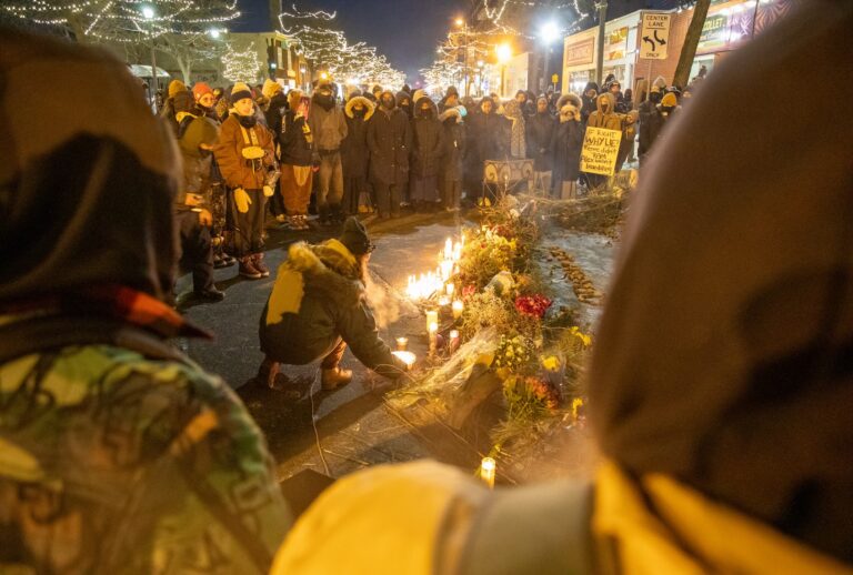 Protesters hold a vigil over the spot where federal agents killed Alex Pretti in Minneapolis, United States, on January 24, 2026. (Photo by Arthur Maiorella/Anadolu via Getty Images)