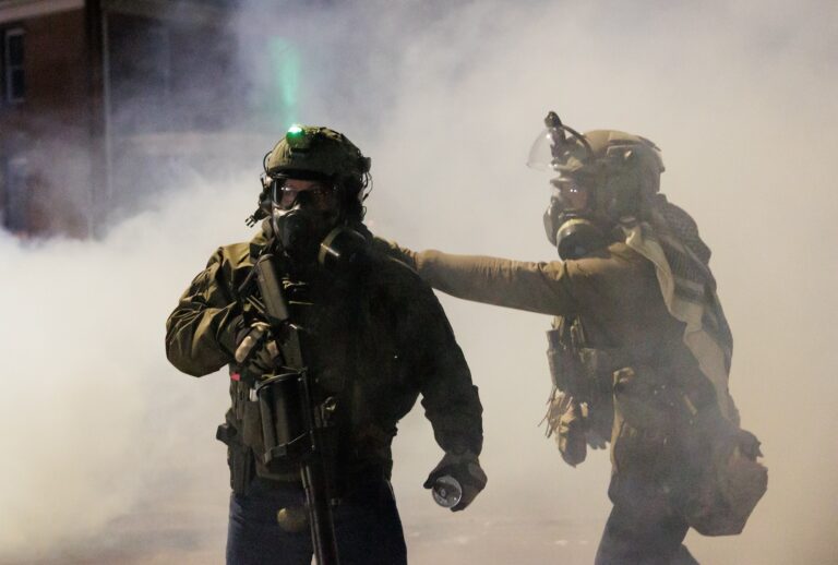 MINNESOTA, UNITED STATES - JANUARY 14: Federal agents deploy tear gas as residents protest a federal agent-involved shooting during an immigration enforcement operation in Minneapolis, Minnesota, United States on January 14, 2026. The protest comes after a federal agent-involved shooting during immigration enforcement, exactly one week after a federal agent shot and killed 37-year-old Renee Good. (Photo by Madison Thorn/Anadolu via Getty Images)