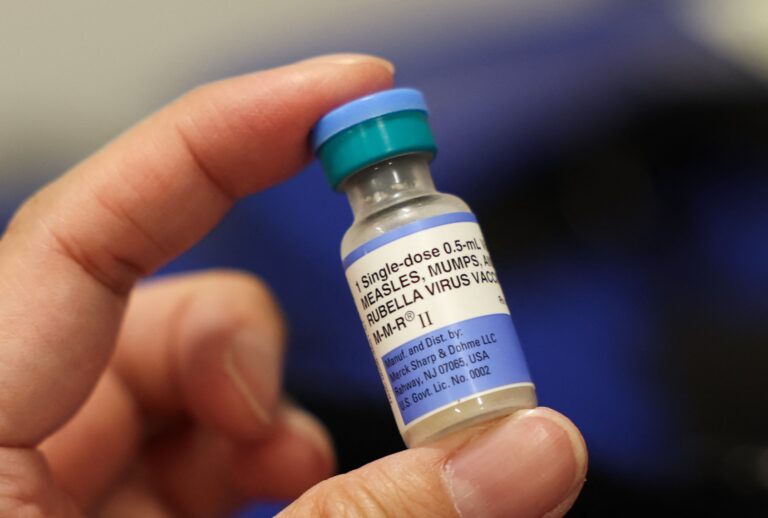 A vial of the Measles, Mumps, and Rubella vaccination for children is displayed during an immunization event at the L.A. Care and Blue Shield of California Promise Health Plan Community Resource Center in Los Angeles, California, on October 24, 2025. (Photo by Patrick T. Fallon / AFP via Getty Images)