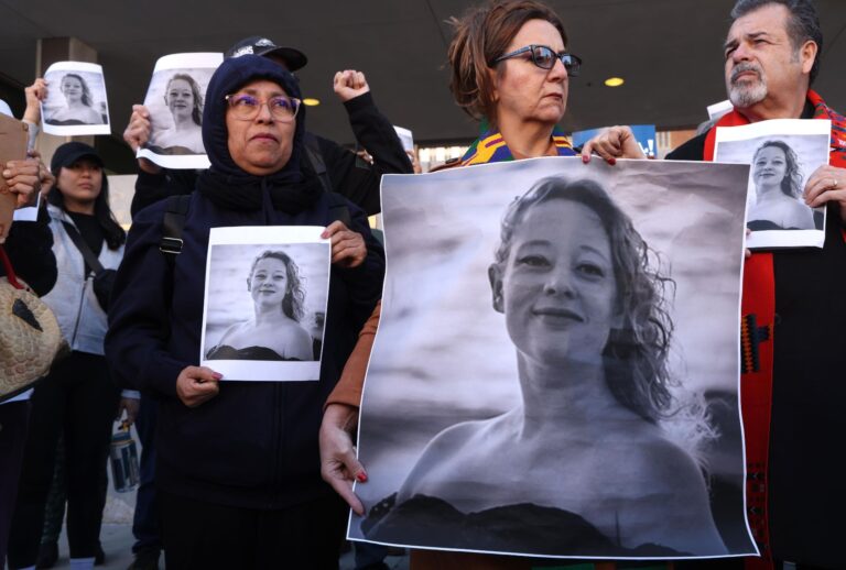Protesters hold photos of Renee Nicole Good, the day after her shooting death Wednesday by an ICE agent in Minneapolis, in front of the Federal Building in downtown Los Angeles on January 8, 2026. (Genaro Molina/Los Angeles Times via Getty Images)
