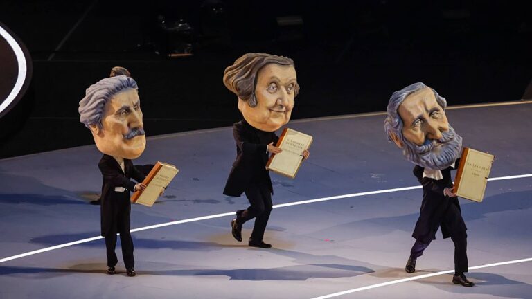 Three big-head caricatures of famed Italian composers (left to right) Puccini, Rossini and Verdi danced as part of the ode to the arts in the Opening Ceremonies of the 2026 Winter Olympics. (DeFodi Images / Getty Images)