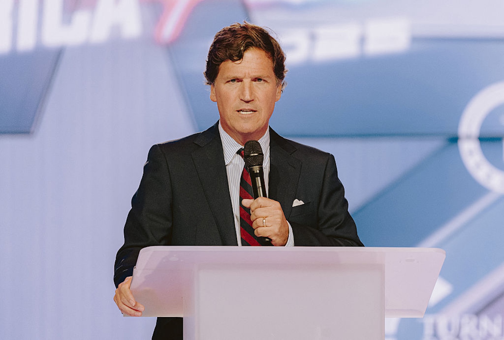 MAGA commentator and podcast host Tucker Carlson is particularly skilled at pandering to the basest instincts of the right. (Olivier Touron / AFP via Getty Images)