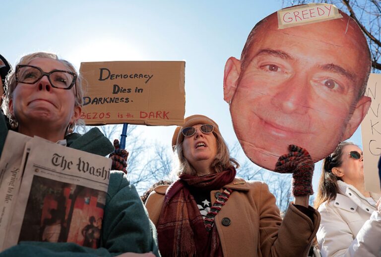 Washington Post readers joined members of the newspaper's guild to protest Jeff Bezos' mass layoffs on Feb. 5, 2026. (Heather Diehl/Getty Images)