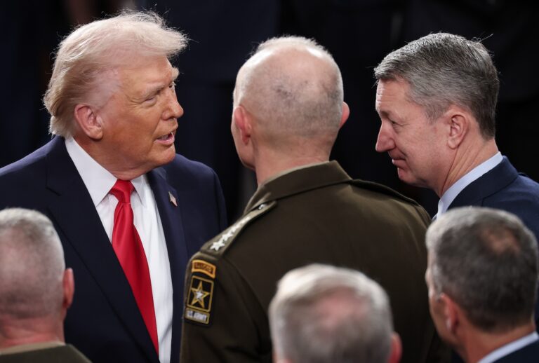 President Donald Trump speaks with members of the Joint Chiefs of staff before delivering his State of the Union address on February 24, 2026 amid a U.S. military buildup in the Persian Gulf threatening Iran. (Photo by Win McNamee/Getty Images)