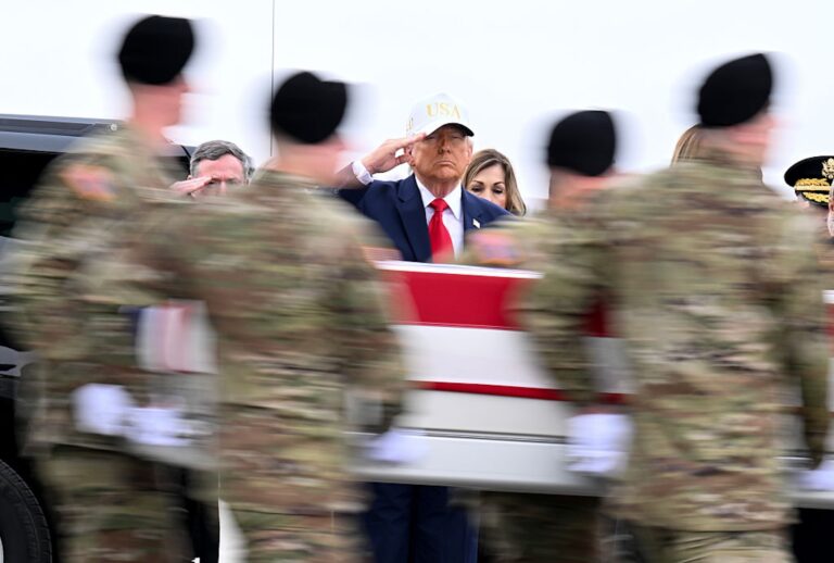 President Donald Trump dons a branded Trump 45-47 hat while attending the dignified transfer of remains at Dover Air Force Base. (Roberto Schmidt/Getty Images)