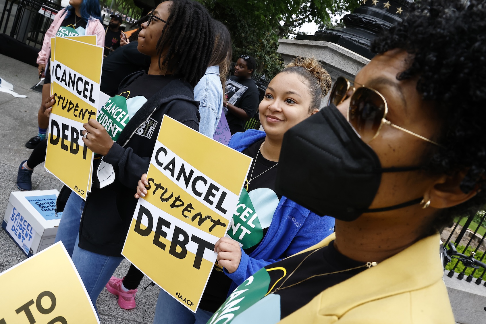 Student loan borrowers gather near The White House to tell President Biden to cancel student debt on May 12, 2020 in Washington, DC. (Photo by Paul Morigi/Getty Images)
