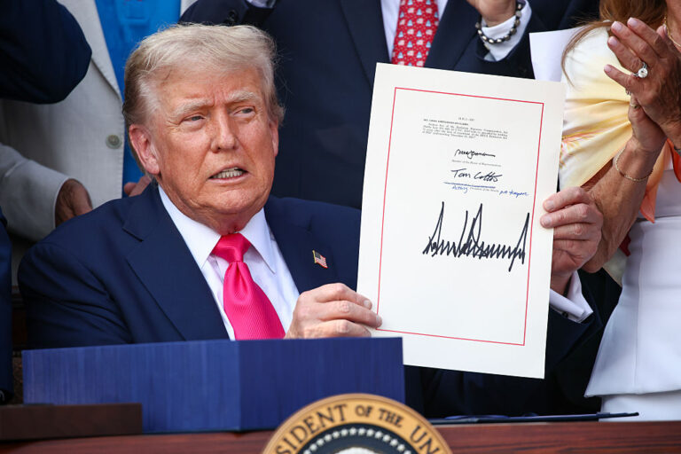 President Trump's signature has become ubiquitous with his many executive orders, but now it will be featured on legal U.S. currency, a first in over 100 years for a sitting president. (Samuel Corum / Getty Images)