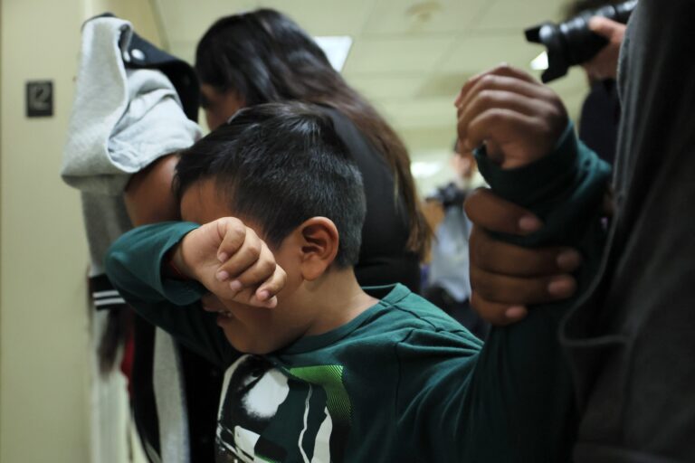 A child cries after his father is detained by federal agents as they left a court hearing in immigration court at the Jacob K. Javits Federal Building on August 26, 2025 in New York City. (Photo by Michael M. Santiago/Getty Images)