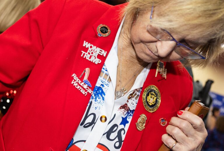 An attendee walks through the exhibition hall during the Conservative Political Action Conference, at the Gaylord Texan Resort & Convention Center, in Grapevine, Texas, on March 25, 2026. (Leandro Lozada / AFP via Getty Images)