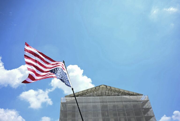 An American flag outside the US Supreme Court building on May 15, 2025. (Photo by Jim WATSON / AFP via Getty Images)