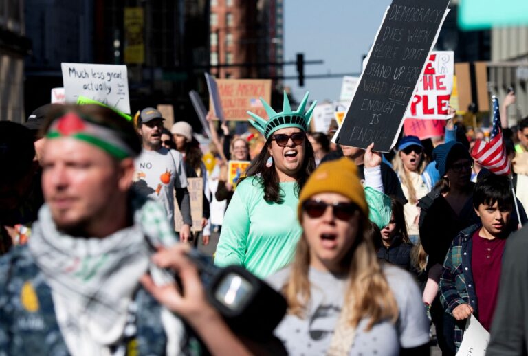 Demonstrators protest the Trump administration during the "No Kings" national rally in Denver, Colorado on October 18, 2025. (JASON CONNOLLY/AFP via Getty Images)