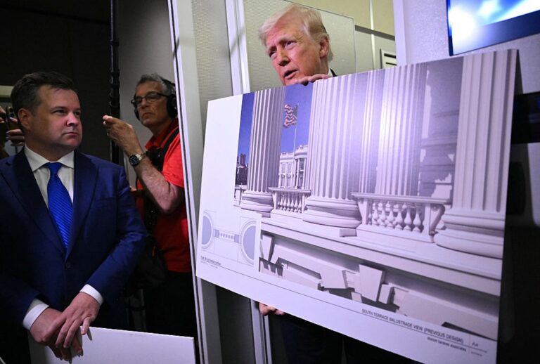 President Donald Trump displays a rendering of his White House ballroom project, which will feature references to Roman architecture. (Mandel NGAN / AFP via Getty Images)