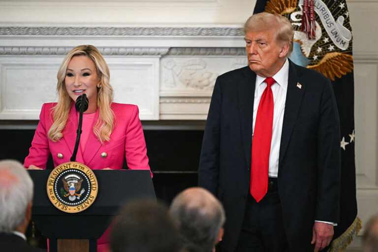 Pastor Paula White and President Trump at a faith luncheon in 2025. She is known for mixing her faith with right-wing politics as she serves as Trump's chief spiritual adviser. (	ANDREW CABALLERO-REYNOLDS / Getty Images)