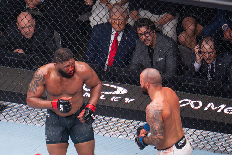 President Donald Trump has ringside seat with UFC officials to watch the latest heavyweight match in Miami. He also promoted his birthday UFC fight in June as peace deals with Iran fall through and tensions escalate. (Jim WATSON / Getty Images)