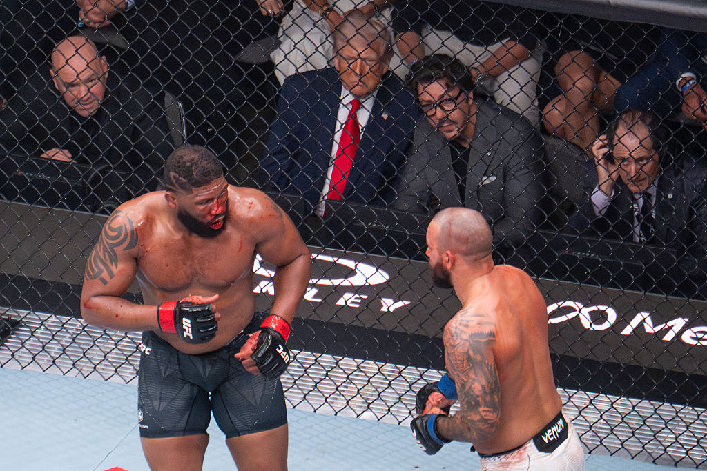 President Donald Trump has ringside seat with UFC officials to watch the latest heavyweight match in Miami. He also promoted his birthday UFC fight in June as peace deals with Iran fall through and tensions escalate. (Jim WATSON / Getty Images)