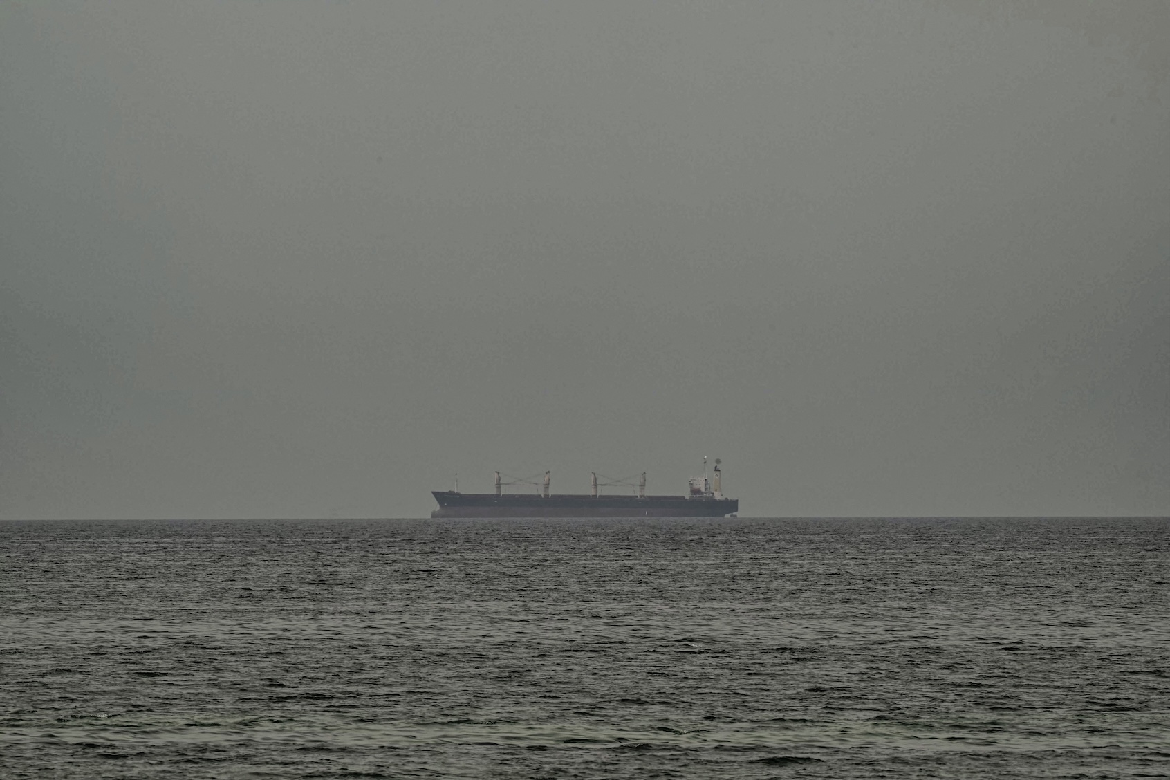 A ship is seen in the Persian Gulf off the coast of Sharjah the day after the failure of US-Iran peace talks on April 13, 2026. The failure of US-Iran peace talks has left the US President with several unpalatable options, as analysts say his order to blockade the strategic Strait of Hormuz could further complicate his next move on April 12, 2026. Any hopes that US Vice President would emerge from the marathon day of negotiations with top Iranian officials with a deal to end a war that has rippled across the Middle East were dashed when he left hosts Pakistan emptyhanded. (Photo by AFP/Getty Images)