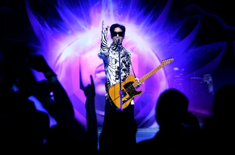 Prince performs his first of three shows onstage during "One Night... Three Venues" in 2009 t (Photo by Kristian Dowling/Getty Images)