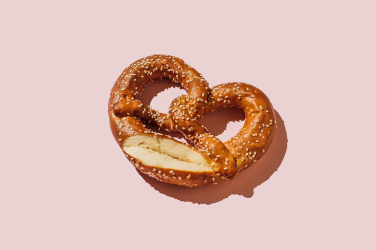 Pretzels on pink background (Tanja Ivanova / Getty Images)