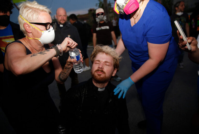 Rev. David Black receives medical attention after being pepper sprayed by ICE officers during a protest in Broadview, Illinois, Sept. 19, 2025. (Octavio Jones/AFP via Getty Images)