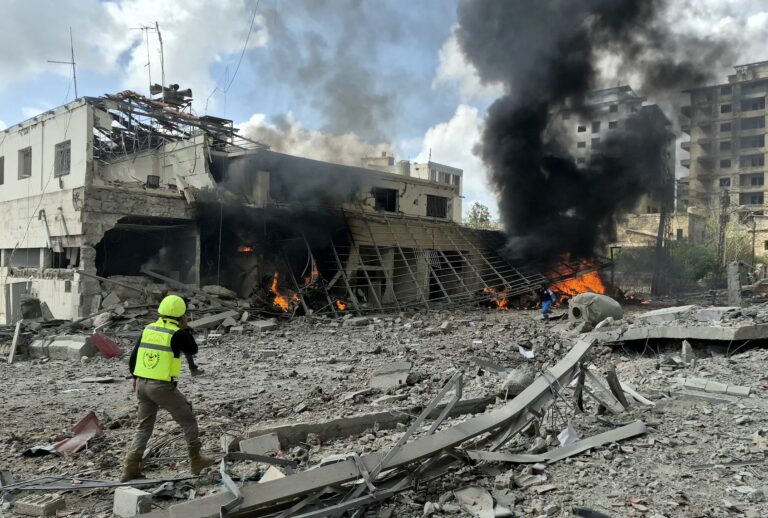 First responders rush to the site of an Israeli airstrike that targeted the Lebanese State Security Center, in the Southern Lebanese city of Nabatieh on April 10 2026. (Photo by Abbas Fakih / AFP via Getty Images)
