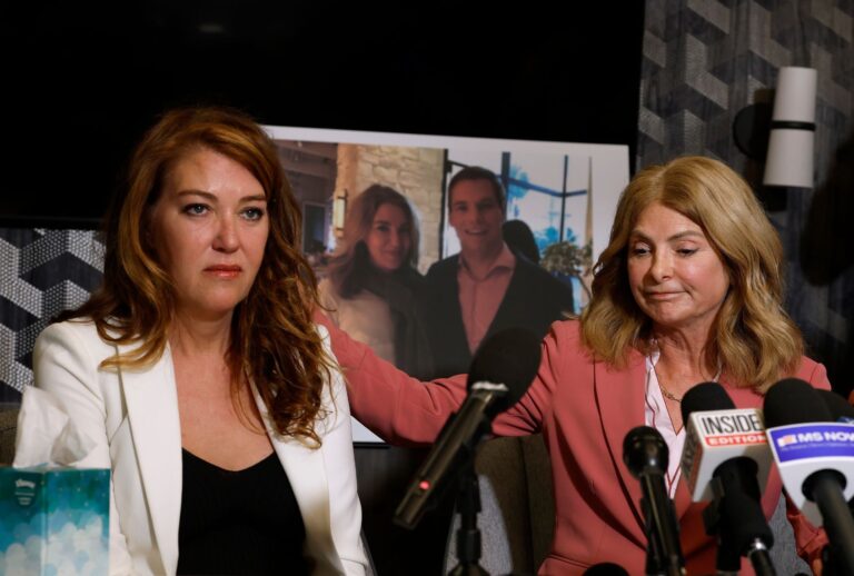 Attorney Lisa Bloom (R) comforts Lonna Drewes during a press conference in which Drewes accused U.S. Rep. Eric Swalwell (D-CA) of sexual assault, on April 14, 2026 in Beverly Hills, California. (Justin Sullivan/Getty Images)