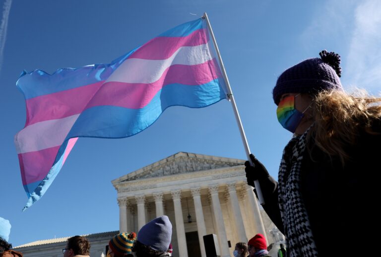 A transgender rights supporter takes part in a rally outside of the U.S. Supreme Court as the high court hears arguments in a case on transgender health rights on December 04, 2024 in Washington, DC. (Photo by Kevin Dietsch/Getty Images)