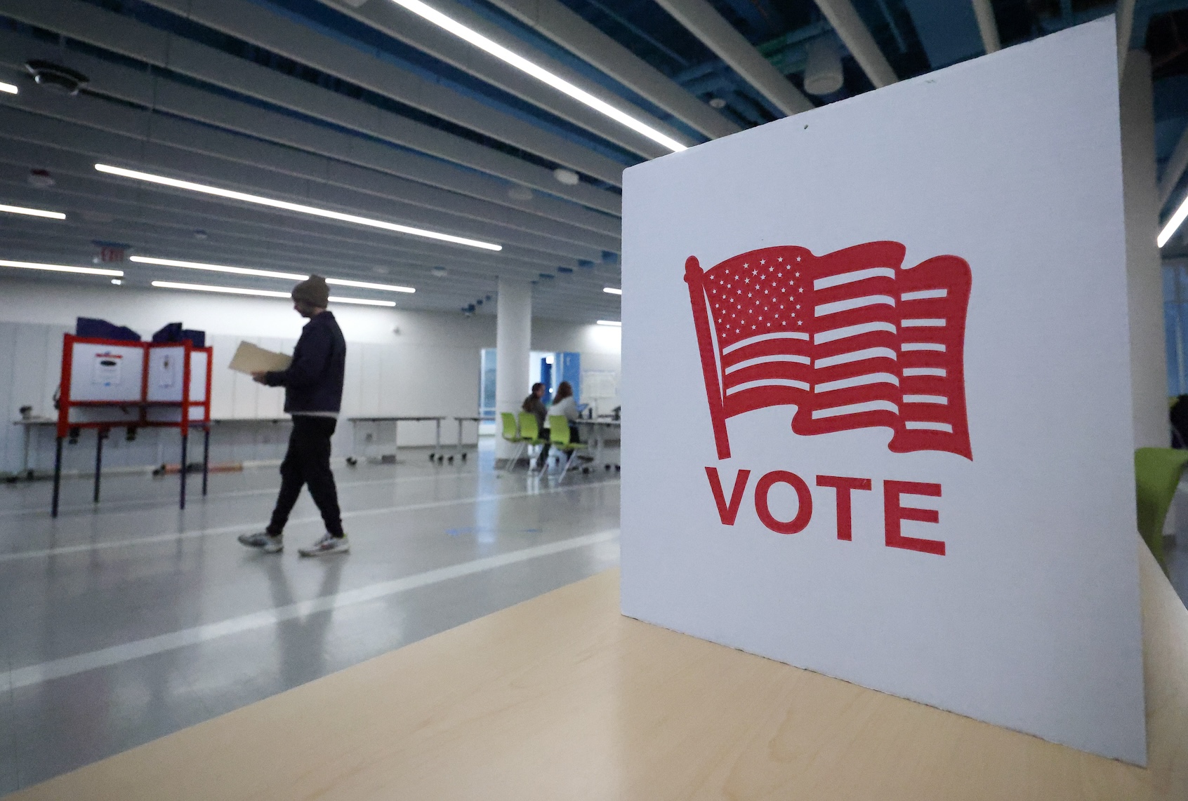 Voters cast their ballots at a polling location on April 21, 2026 in Arlington, Virginia. (Photo by Win McNamee/Getty Images)