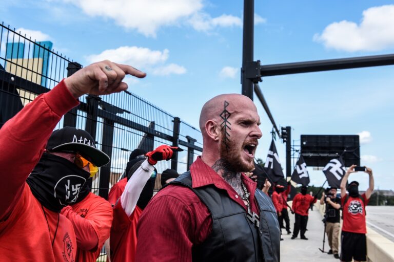 Christopher “Hammer” Pohlhaus leads a rally with neo-Nazi groups Blood Tribe, and Goyim Defense League on September 2, 2023 in Orlando, Florida. An event touted as the "Red Shirts March" and a show of unity for Neo-Nazis attracted about 100 people to participate. (Photo by Stephanie Keith/Getty Images)
