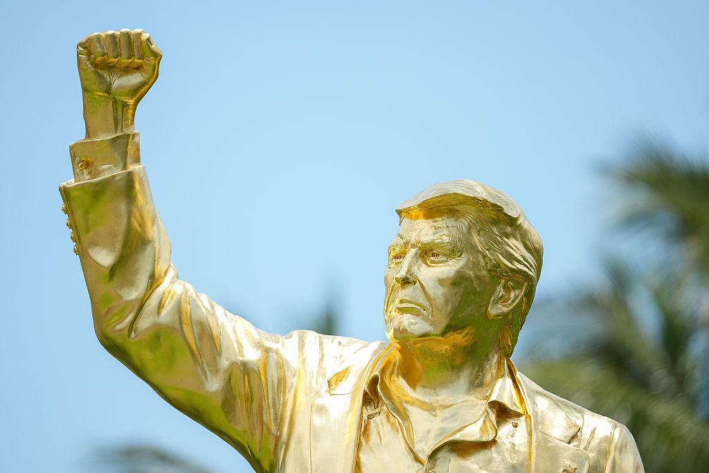 The sculptor behind the latest golden statue of President Trump speaks out about the process of building, gilding and getting paid by "cryptobros" for his work. (Ben Jared / Getty Images)