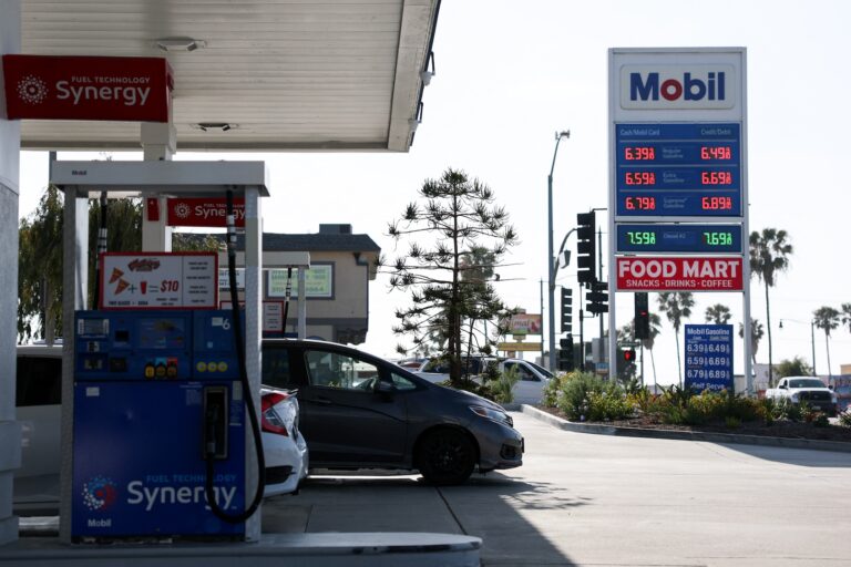 Vehicles sit parked at fuel pumps as regular gasoline prices above $6 per gallon and diesel prices above $7 per gallon are displayed outside a Mobil gas station in Redondo Beach, California on April 30, 2026. (Photo by Patrick T. Fallon/Getty Images)