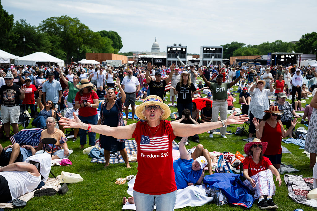 Thousands showed up to be part of Rededicate250, a Christian Nationalist prayer gathering they say is to help get America back to its "Christian roots" through prayer, worship and special speakers. (Graeme Sloan / Getty Images)