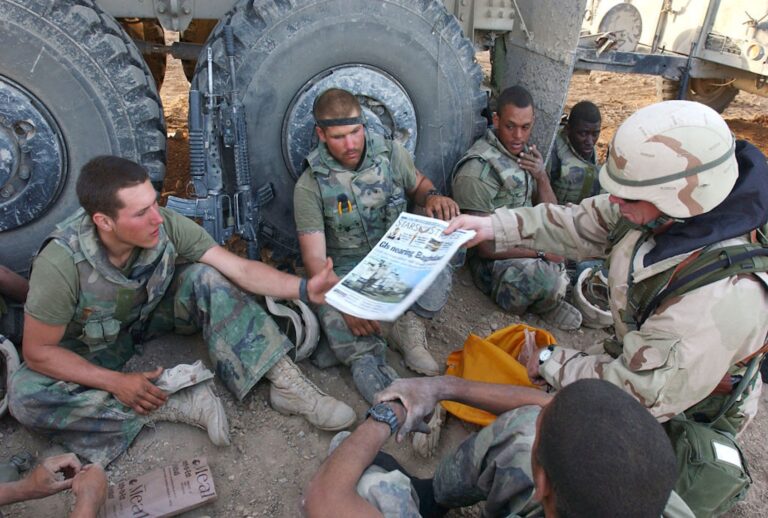 Marines in Iraq receive copies of Stars and Stripes in 2003 (DAVID K. DISMUKES/US NAVY/AFP via Getty Images)