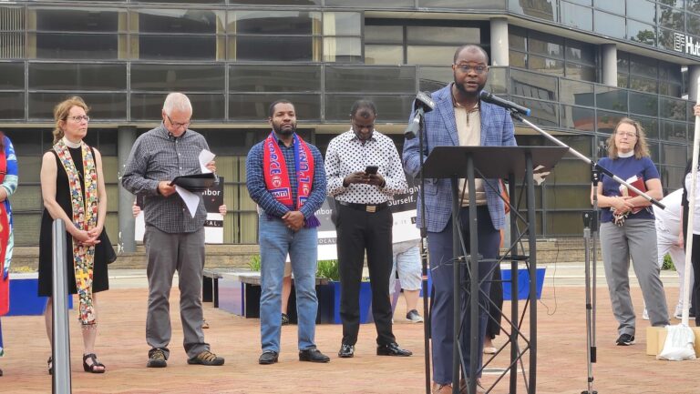Vilès Dorsainvil, the executive director of the Haitian Community Support Center in Springfield, Ohio, speaks at a community vigil on June 25, 2026. (Tatyana Tandanpolie for Salon)