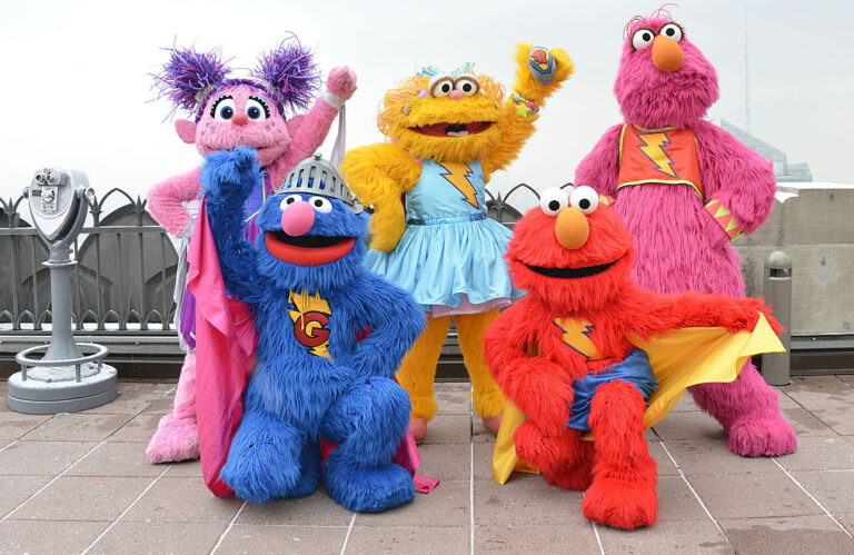 Sesame Street's resident "Superheroes" visit NYC landmarks, as part of their lifelong support of their city. This picture of Abby Cadabby, Grover, Zoe, Elmo and Telly (left to right) is from Top of the Rock in 2013. (Eugene Gologursky / Getty Image)