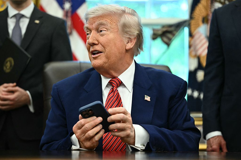 Trump is a "terminally online" president. His Truth Social tirades continue with new AI videos, memes and images. (MANDEL NGAN / Getty Images)