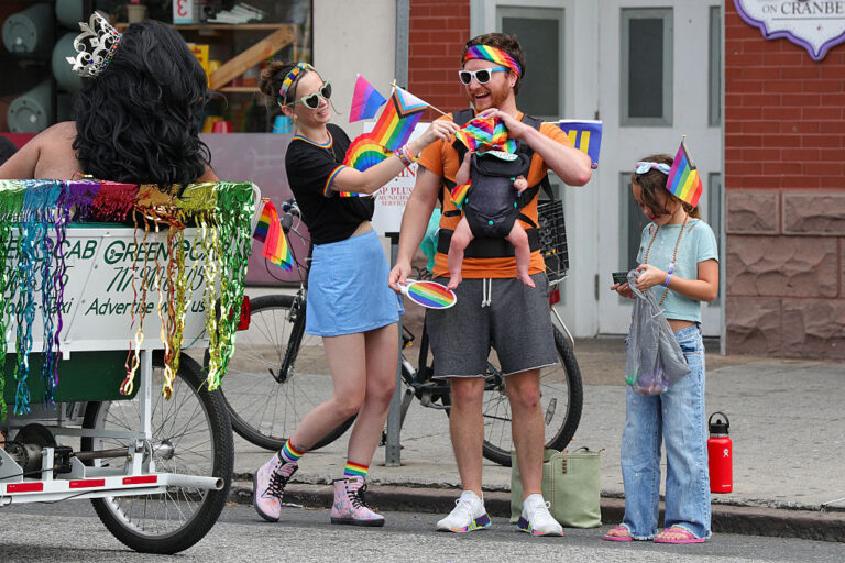 A husband, wife and their two children celebrate their local Pride Parade, despite many states counterprogramming local Pride events with what they deem as more "family" oriented celebrations. (Paul Weaver / Getty Images)
