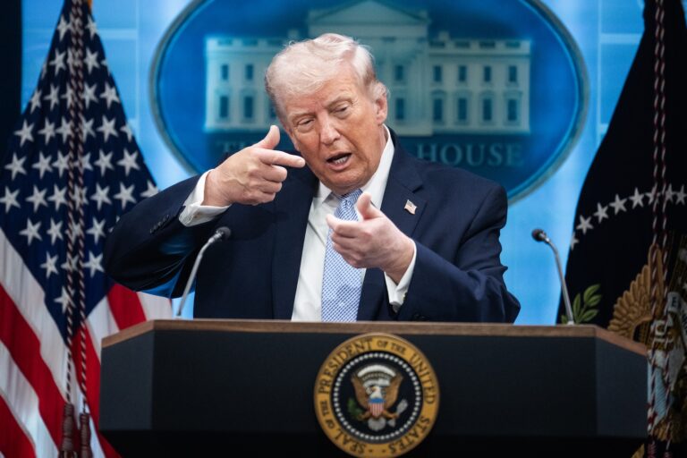 President Donald Trump mimics firing a gun during a news conference in the White House briefing room about the war in Iran on Monday, April 6, 2026. ((Photo by Tom Williams/GETTY IMAGES))