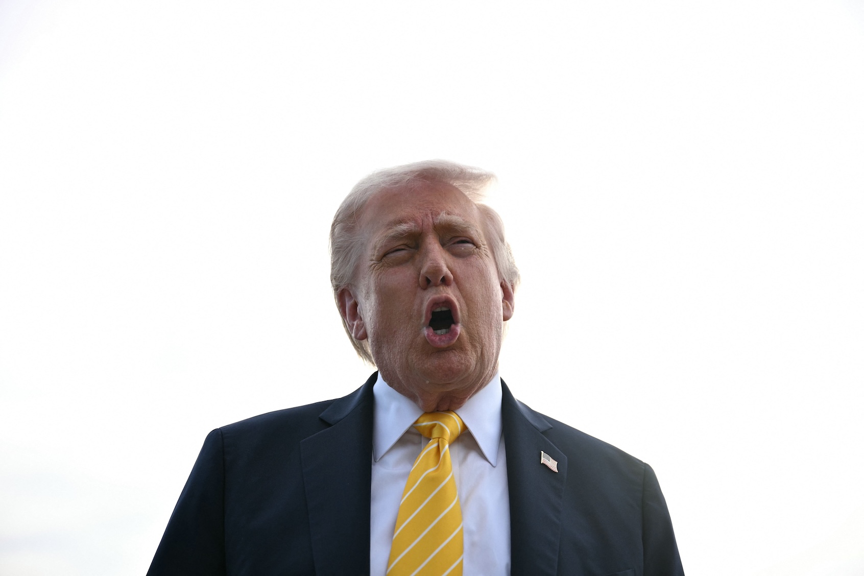 US President Donald Trump speaks with reporters at Palm Beach International Airport in West Palm Beach, Florida on May 2, 2026, before boarding Air Force One en route to Miami. (Photo by Jim Watson/Getty Images)