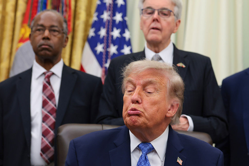 President trump reacts during an Oval Office press conference with faith leaders and allies including Dr. Ben Carson and Texas Lt. Gov. Dan Patrick. (Anna Moneymaker / Getty Images)
