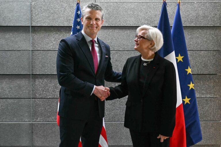 French Minister of the Armed Forces Catherine Vautrin and U.S. Defense Secretary Pete Hegseth at a ceremony marking the 82nd anniversary of the D-Day landings, Normandy American Cemetery, Colleville-sur-Mer, France, June 6, 2026. (Lou Benoist/AFP via Getty Images)