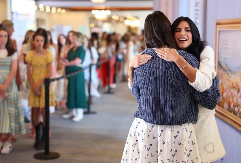 Alex Clark greets an attendee during a meet and greet session during the Turning Point USA Young Women's Leadership Summit at the Gaylord Texan Resort and Convention Center on June 14, 2025 in Grapevine, Texas. (Photo by Sam Hodde for The Washington Post via Getty Images)