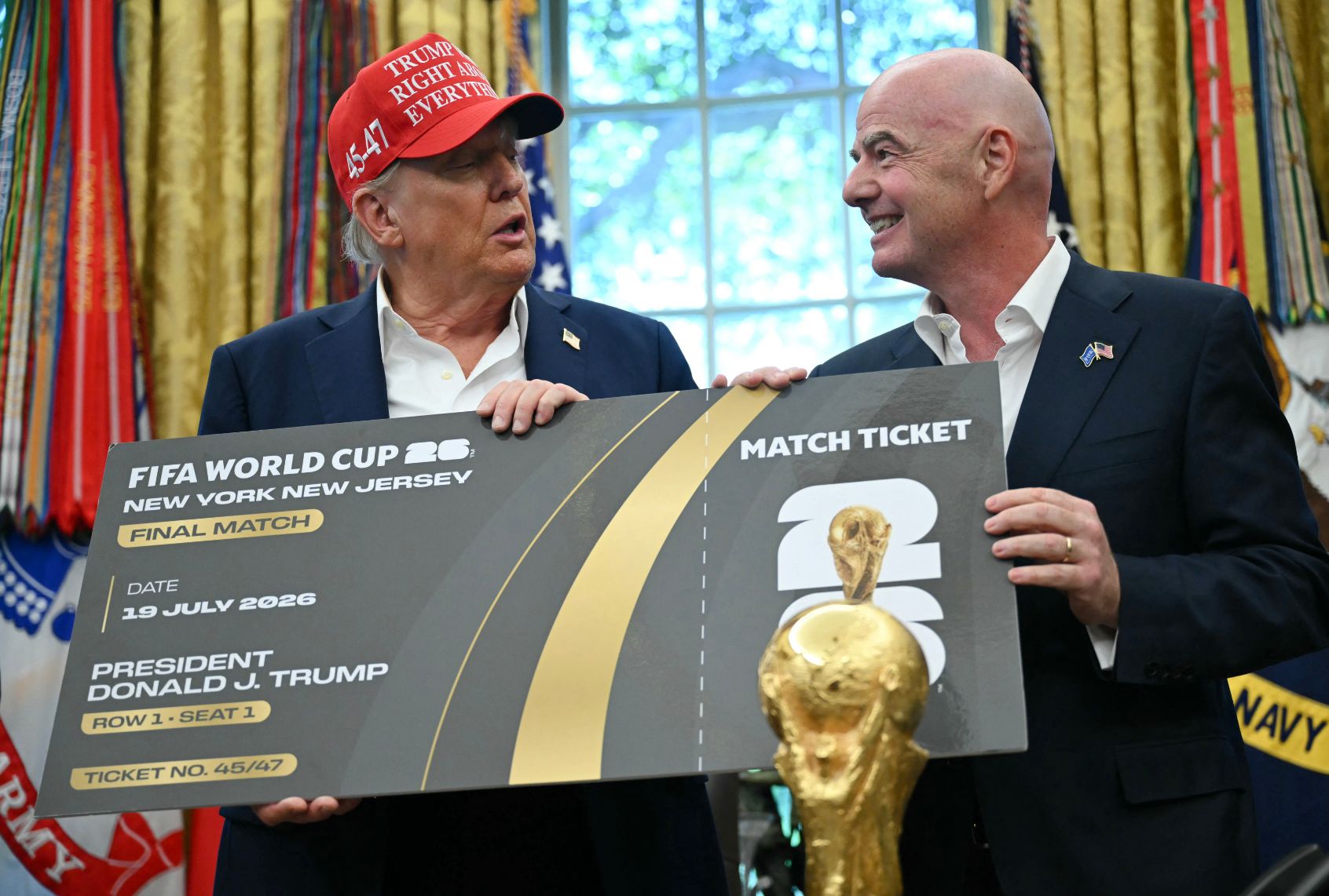 FIFA president Gianni Infantino presents President Donald Trump a World Cup ticket on August 22, 2025. (ANDREW CABALLERO-REYNOLDS/AFP via Getty Images)